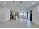 Spacious living room with sliding glass doors, tile floors, and recessed lighting at 4633 Fragrant St, North Las Vegas, NV 89031