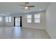 Bright living area with tile floors, ceiling fan, recessed lighting, and access to the backyard at 4633 Fragrant St, North Las Vegas, NV 89031