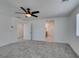 Main bedroom featuring a ceiling fan, carpet flooring and ensuite bath at 4633 Fragrant St, North Las Vegas, NV 89031