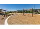 Community park with walking paths, swings, shade structure, and manicured landscaping at 4633 Fragrant St, North Las Vegas, NV 89031