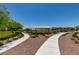 Scenic park view featuring a walking path, picnic pavilion, and lush landscaping at 4633 Fragrant St, North Las Vegas, NV 89031