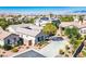 Overhead view of a home with solar panels on the roof nestled within a community of similarly styled homes in Nevada at 5017 Kaibab Forest Ave, Las Vegas, NV 89141