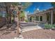 Backyard featuring a cozy covered hot tub, rock landscaping and access to the home at 5017 Kaibab Forest Ave, Las Vegas, NV 89141