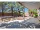 Backyard view featuring a covered patio, hot tub, and privacy wall at 5017 Kaibab Forest Ave, Las Vegas, NV 89141