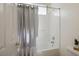 Bright bathroom with a shower-tub combination and a decorative plant at 5017 Kaibab Forest Ave, Las Vegas, NV 89141