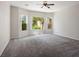 Bright bedroom featuring large windows and a ceiling fan, offering ample natural light at 5017 Kaibab Forest Ave, Las Vegas, NV 89141