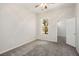 Bedroom with carpet, a window overlooking nature and a doorway leading to an adjacent room at 5017 Kaibab Forest Ave, Las Vegas, NV 89141