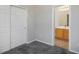 Bedroom featuring carpet, a closet, and a glimpse into the adjacent bathroom at 5017 Kaibab Forest Ave, Las Vegas, NV 89141