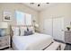 Bright staged bedroom featuring modern decor, soft lighting, and a serene ambiance at 5017 Kaibab Forest Ave, Las Vegas, NV 89141