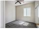 Bright bedroom featuring carpeted floors, overhead fan, and neutral color palette at 5017 Kaibab Forest Ave, Las Vegas, NV 89141