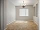 Well-lit dining room with tile floors, a chandelier, and a large window with blinds at 5017 Kaibab Forest Ave, Las Vegas, NV 89141