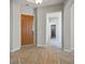 Beautiful foyer with tile flooring and a decorative inlay design as well as a solid wood front door at 5017 Kaibab Forest Ave, Las Vegas, NV 89141