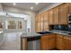Well-equipped kitchen with oak cabinets, granite countertops, and stainless steel appliances at 5017 Kaibab Forest Ave, Las Vegas, NV 89141