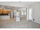 Bright kitchen with modern appliances and an eat-in bar, seamlessly connecting to the dining and living spaces at 5017 Kaibab Forest Ave, Las Vegas, NV 89141