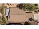 Bird's eye view of a well-maintained roof, a covered patio and mature landscaping in backyard at 502 Edgefield Ridge Pl, Henderson, NV 89012