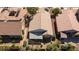 An aerial perspective of home roof, a lattice-covered patio, mature landscaping, and neighboring houses at 502 Edgefield Ridge Pl, Henderson, NV 89012