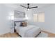 Stylish bedroom with a ceiling fan, window, and neutral decor at 502 Edgefield Ridge Pl, Henderson, NV 89012