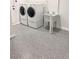 Well-lit laundry room featuring a utility sink and modern appliances at 502 Edgefield Ridge Pl, Henderson, NV 89012