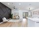Bright living room featuring a modern decor, luxury furniture, and dark accent wall at 502 Edgefield Ridge Pl, Henderson, NV 89012