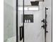 Contemporary shower features frameless doors, marble tile, and a matte black shower head at 502 Edgefield Ridge Pl, Henderson, NV 89012