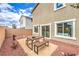 Outdoor dining area with a table and benches in a low-maintenance backyard at 505 Red Lovebird Ave # Lot 1229, Henderson, NV 89011