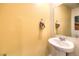 Powder room featuring a pedestal sink and mirror at 505 Red Lovebird Ave # Lot 1229, Henderson, NV 89011