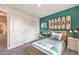 Nicely decorated bedroom featuring skateboard wall art, modern furnishings, and neutral color scheme at 505 Red Lovebird Ave # Lot 1229, Henderson, NV 89011
