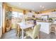 Open-concept dining area with a bright kitchen and stylish seating at 505 Red Lovebird Ave # Lot 1229, Henderson, NV 89011