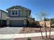 Two-story home featuring a paved driveway and a well-manicured front yard at 505 Red Lovebird Ave # Lot 1229, Henderson, NV 89011
