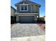 Charming two-story home showcasing a spacious two-car garage and a neatly paved driveway at 505 Red Lovebird Ave # Lot 1229, Henderson, NV 89011