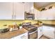 Close up of modern kitchen featuring stainless steel oven, gas range, and white cabinetry at 505 Red Lovebird Ave # Lot 1229, Henderson, NV 89011