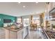 Open concept kitchen with island and stainless steel appliances, flowing into dining and living areas at 505 Red Lovebird Ave # Lot 1229, Henderson, NV 89011