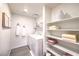 Clean laundry room with washer, dryer, and organized shelving for storage at 505 Red Lovebird Ave # Lot 1229, Henderson, NV 89011