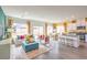 Open-concept living room with a modern kitchen and comfortable seating area at 505 Red Lovebird Ave # Lot 1229, Henderson, NV 89011