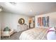 Bright main bedroom featuring neutral walls, a round mirror, and a comfortable seating area at 505 Red Lovebird Ave # Lot 1229, Henderson, NV 89011