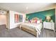Cozy bedroom with a decorative teal accent wall, neutral furnishings, and inviting natural light at 505 Red Lovebird Ave # Lot 1229, Henderson, NV 89011