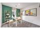 Stylish home office with green accent wall, modern desk, and decorative shelving at 505 Red Lovebird Ave # Lot 1229, Henderson, NV 89011