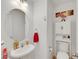Cozy powder room features a pedestal sink and decorative accents at 5321 Welch Valley Ave, Las Vegas, NV 89131