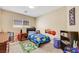 Bright bedroom with fun character decorations, a plush carpet, and a comfortable bed at 5321 Welch Valley Ave, Las Vegas, NV 89131