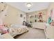 Adorable bedroom is decorated with fun accents and features a brightly colored bedspread at 5321 Welch Valley Ave, Las Vegas, NV 89131