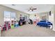 Spacious upstairs bedroom with carpet flooring, ceiling fan, and great natural light at 5321 Welch Valley Ave, Las Vegas, NV 89131