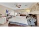 Bedroom with a king bed, makeup vanity, and a lighted ceiling fan at 5321 Welch Valley Ave, Las Vegas, NV 89131