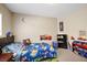 Fun bedroom with character decorations, a dark wood dresser, and a comfortable bed at 5321 Welch Valley Ave, Las Vegas, NV 89131