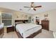 Primary bedroom with a large bed, and a walk in closet at 5321 Welch Valley Ave, Las Vegas, NV 89131