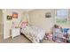 Charming bedroom featuring a floral bedspread, white nightstand, and a sheer canopy at 5321 Welch Valley Ave, Las Vegas, NV 89131