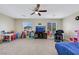 Large bonus room featuring a ceiling fan, lots of light, and plenty of space for various activities at 5321 Welch Valley Ave, Las Vegas, NV 89131