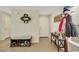 Inviting entryway with tile flooring, coat rack, bench, and neutral color scheme for a welcoming ambiance at 5321 Welch Valley Ave, Las Vegas, NV 89131