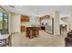 Charming kitchen featuring an island with stool seating, stainless steel appliances, and ample cabinet space at 5321 Welch Valley Ave, Las Vegas, NV 89131