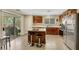 Well-appointed kitchen with an island, stainless steel appliances, and access to the backyard patio at 5321 Welch Valley Ave, Las Vegas, NV 89131