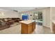 The spacious living room opens to the kitchen and offers access to the backyard at 5321 Welch Valley Ave, Las Vegas, NV 89131
